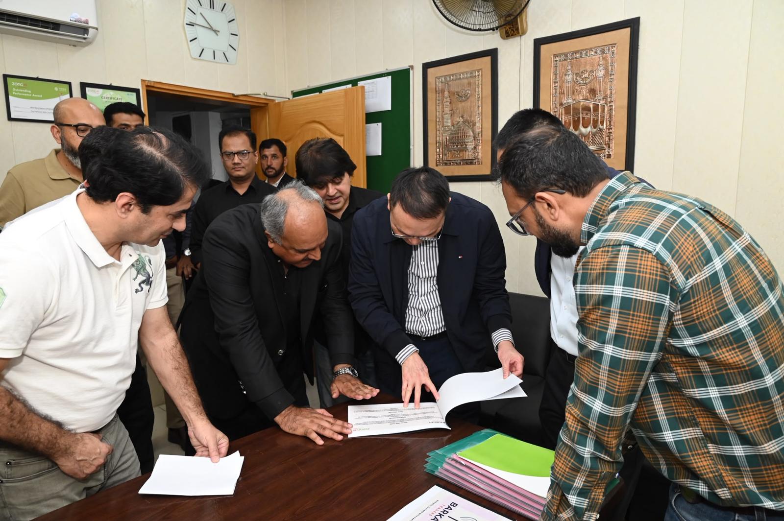 Barkat Traders team reviewing documents in the office
